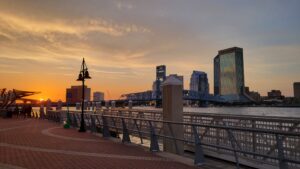 A waterfront view of downtown Jacksonville during sunset