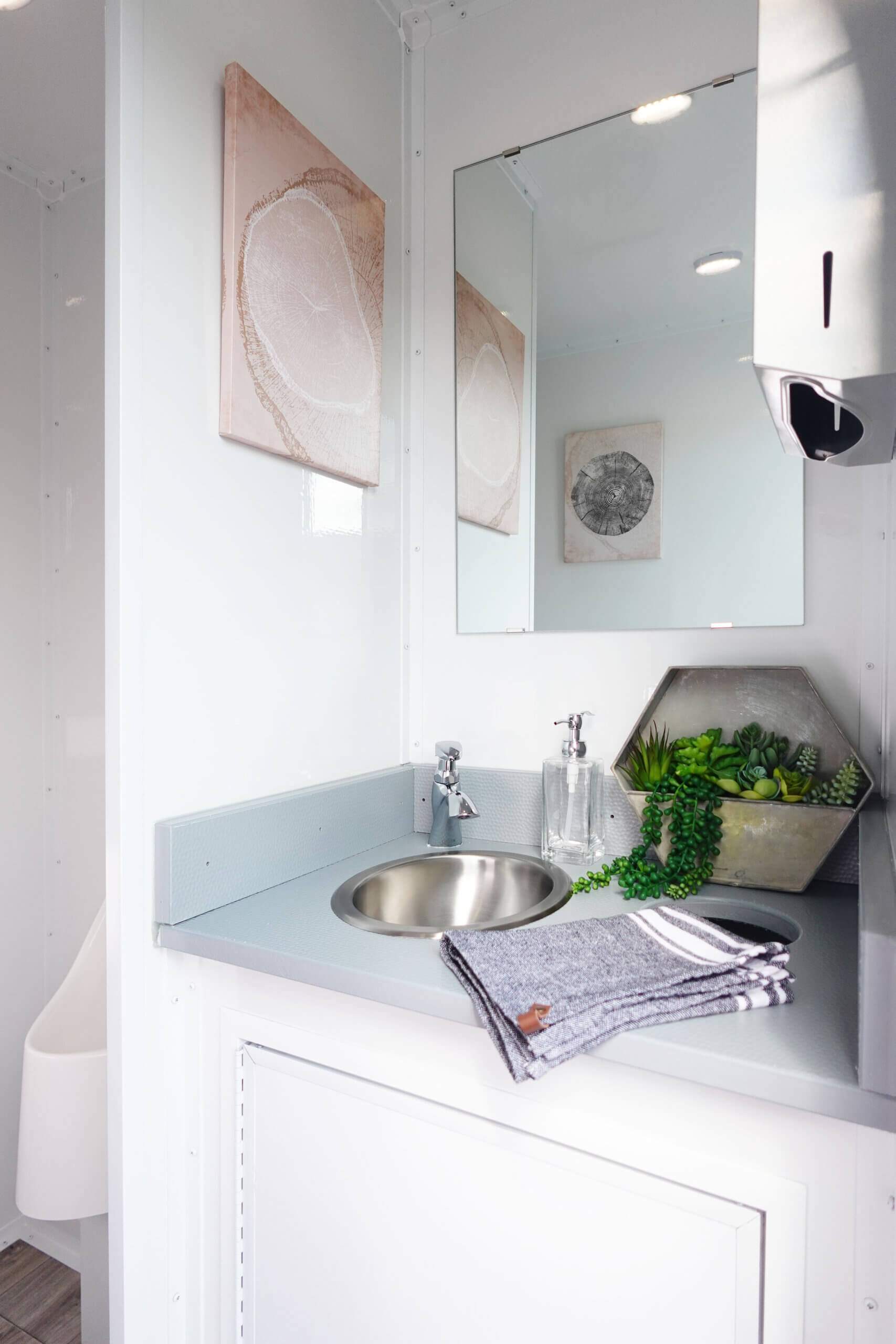 luxury interior photo of five-stall restroom trailer