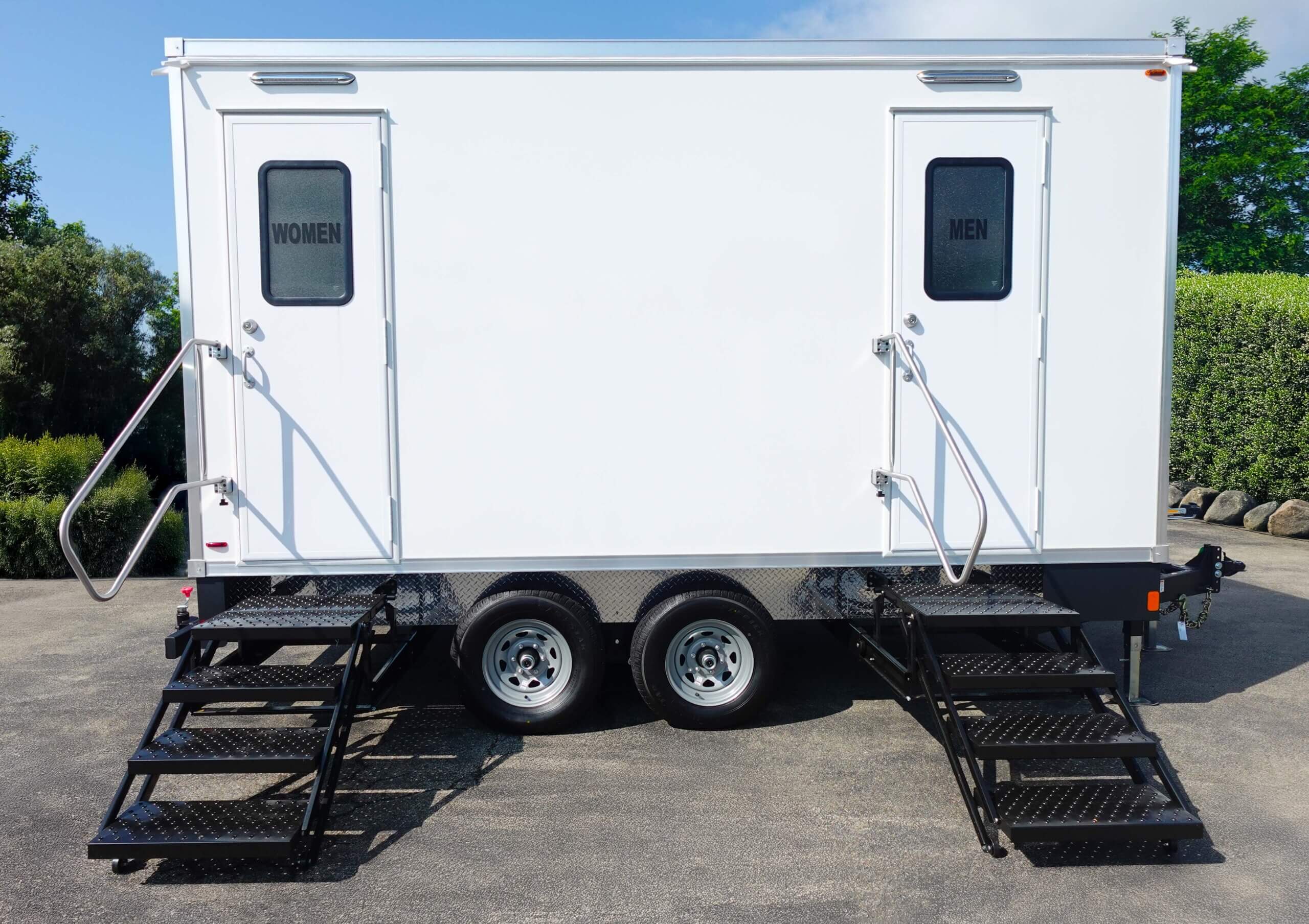 luxury 5-stall restroom trailer parked in parking lot