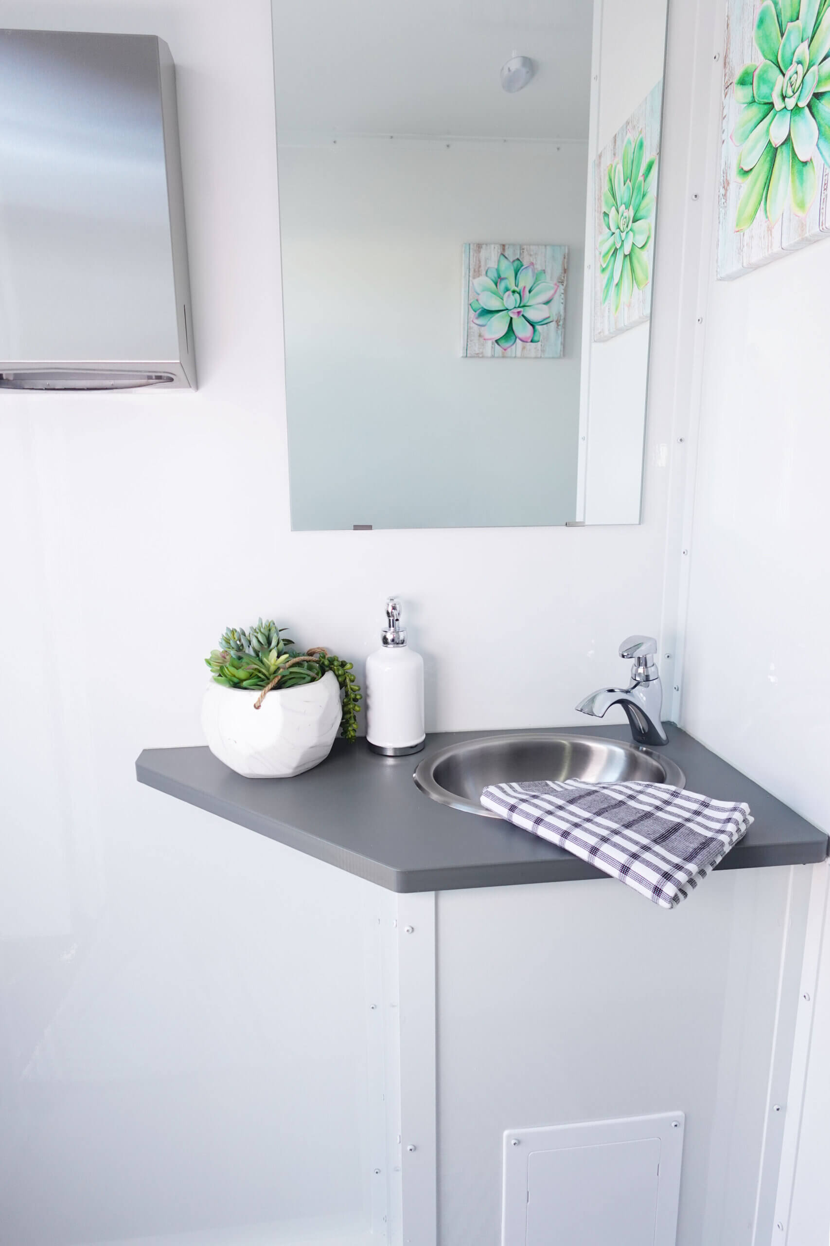 luxury interior photo of three-stall restroom trailer