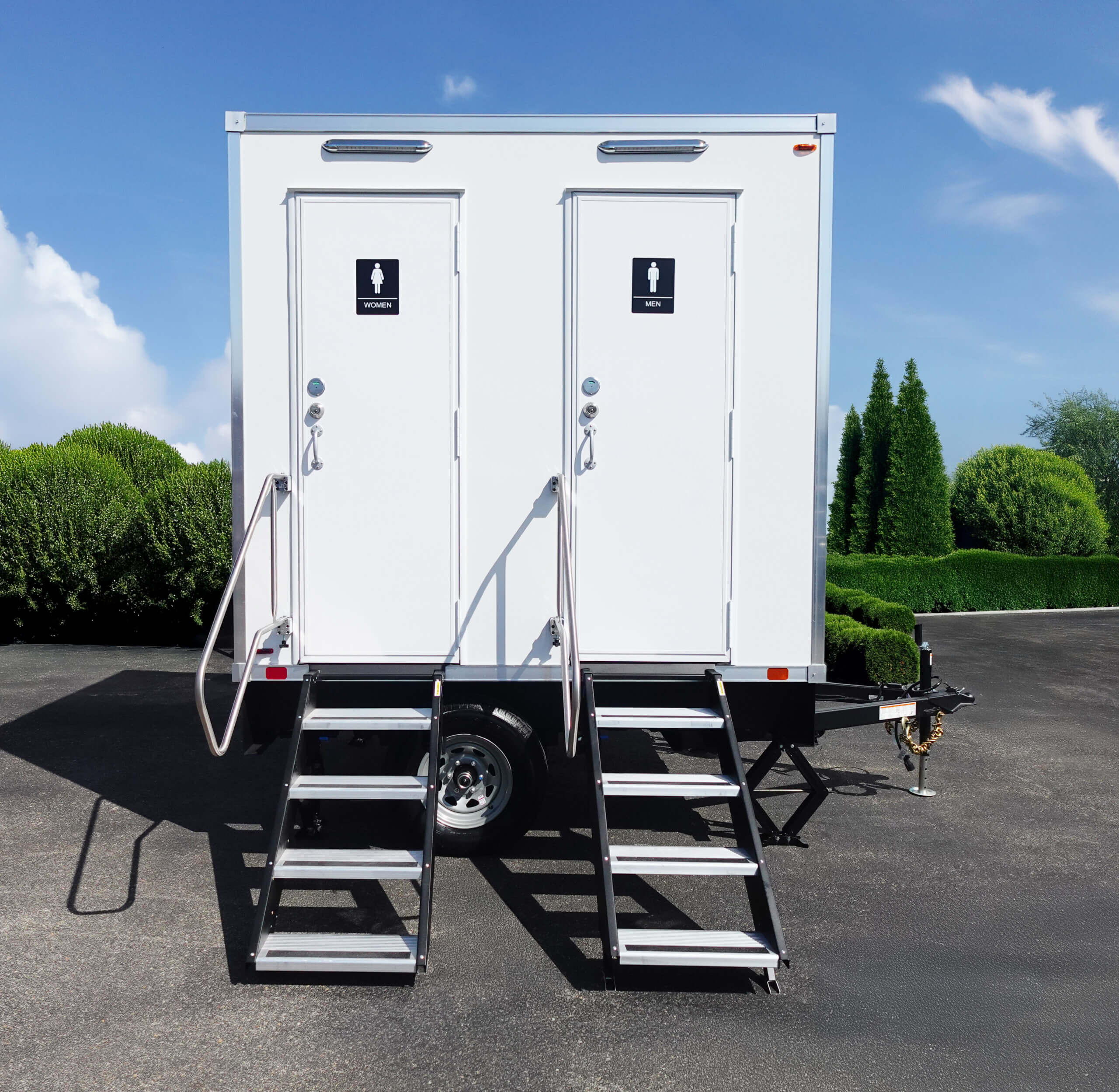 two-station portable bathroom trailer parked in a parking lot in Jacksonville