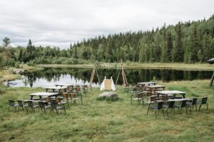Lakefront wedding ceremony with a rural landscape