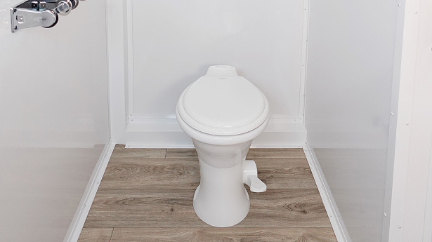 clean toilet stall with white toilet