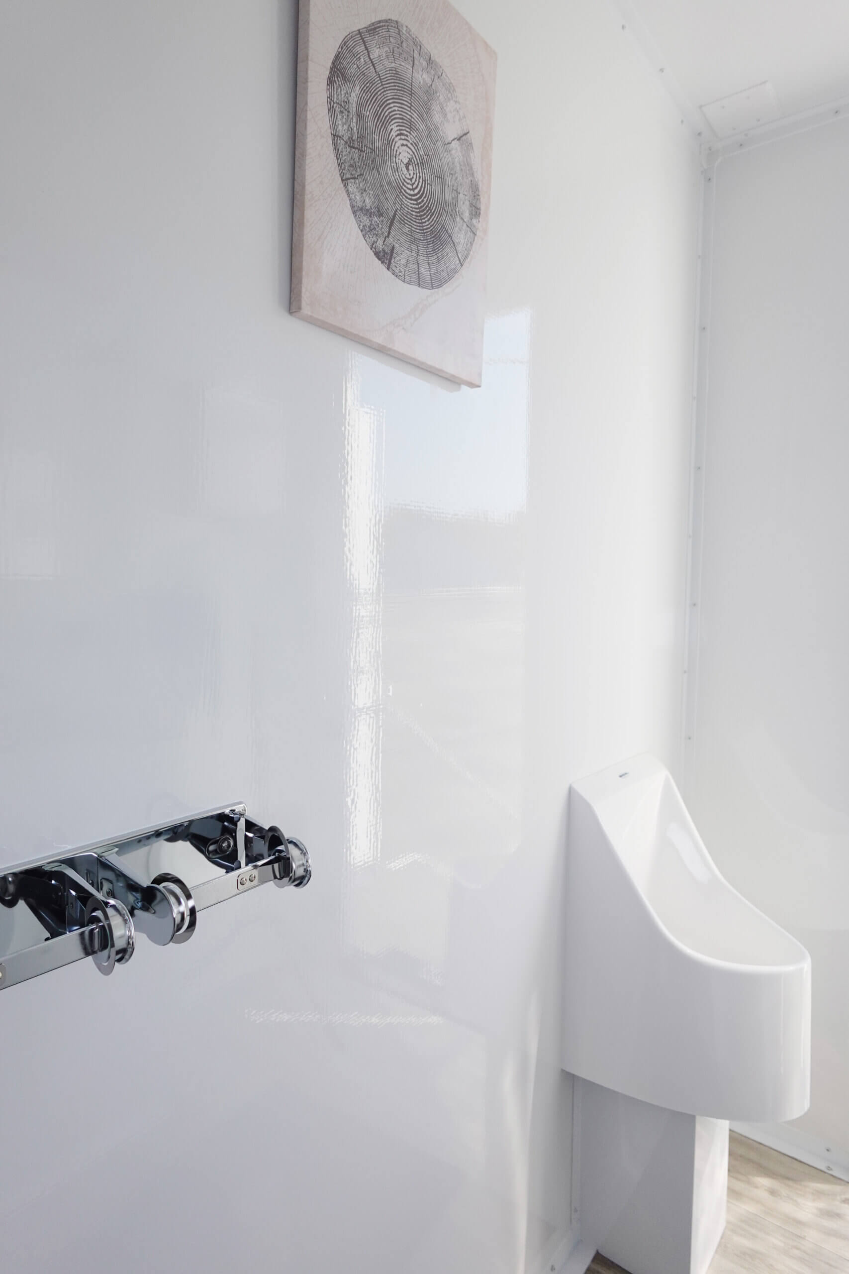 interior photo with urinal in luxury restroom trailer